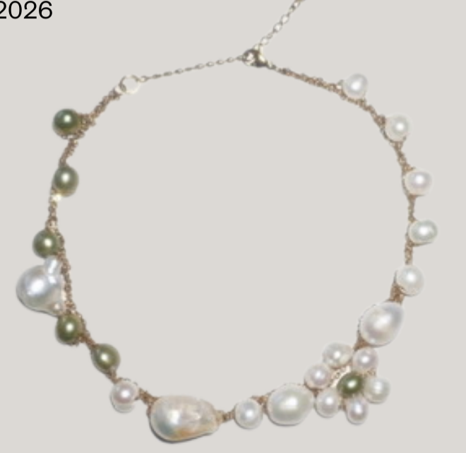 Long strand pearl necklace, flat lay